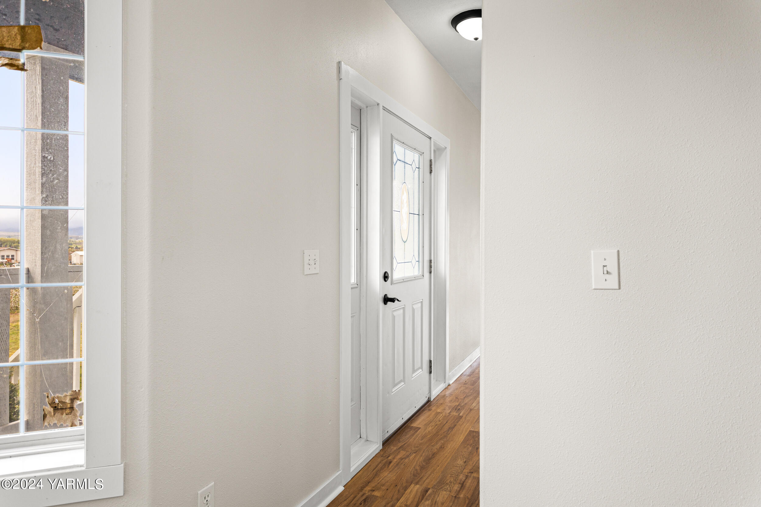 633 Hancock Road Cowiche, WA 98923 - Photo 15 of 53 a view of a hallway with a white walls and a window