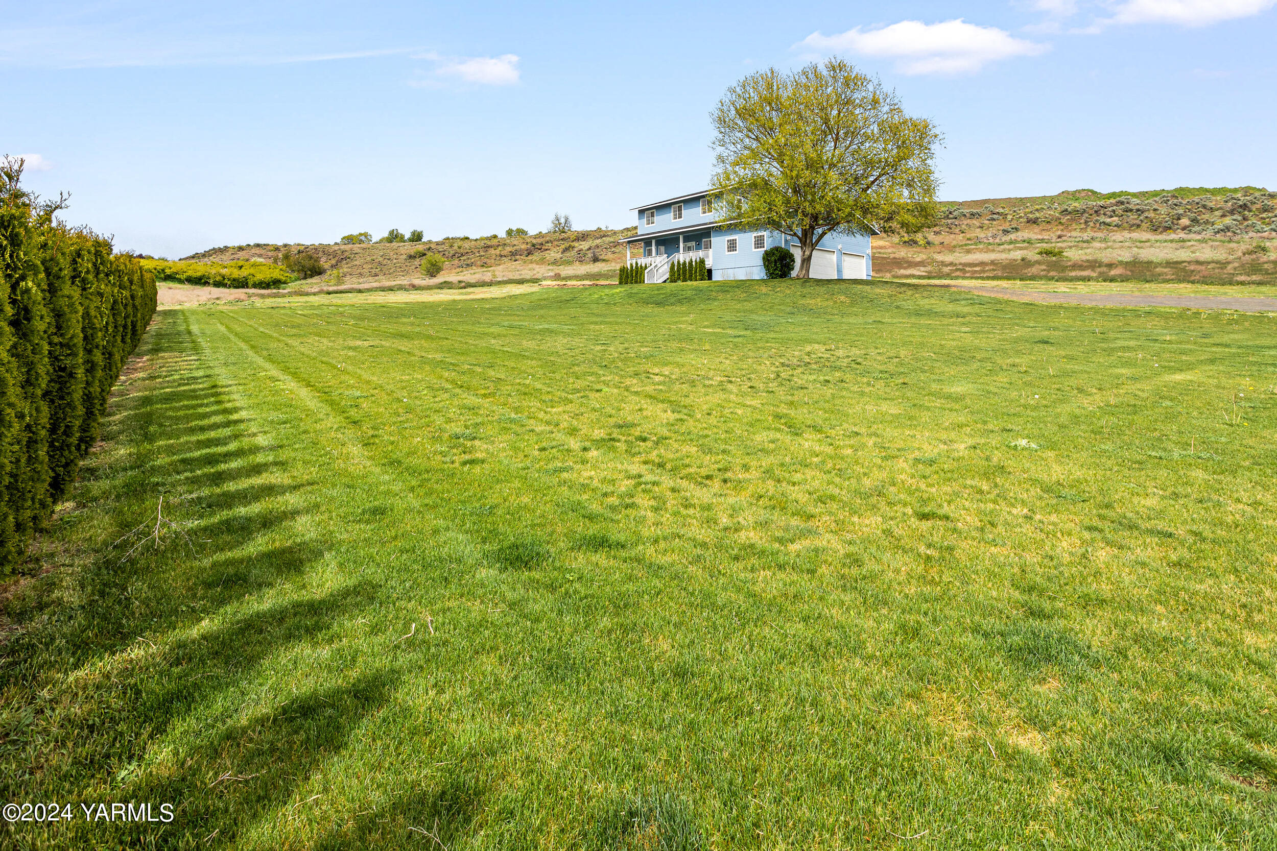 633 Hancock Road Cowiche, WA 98923 - Photo 2 of 53 a view of a large body of water with a building in the background