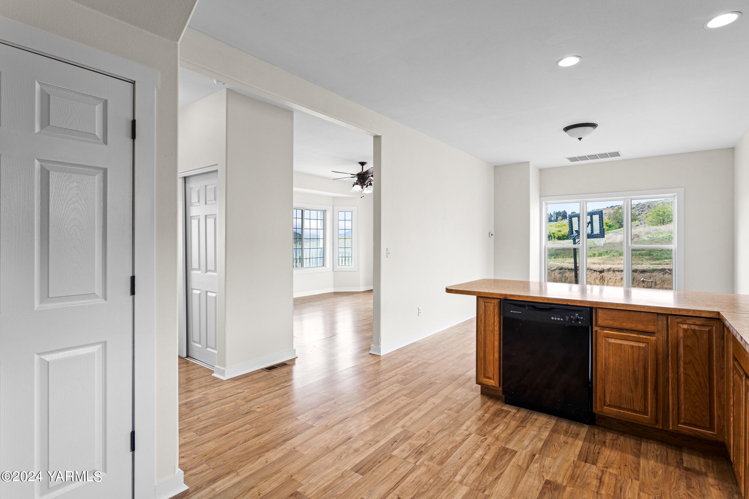 633 Hancock Road Cowiche, WA 98923 - Photo 22 of 53 a view of a kitchen with wooden floor and windows