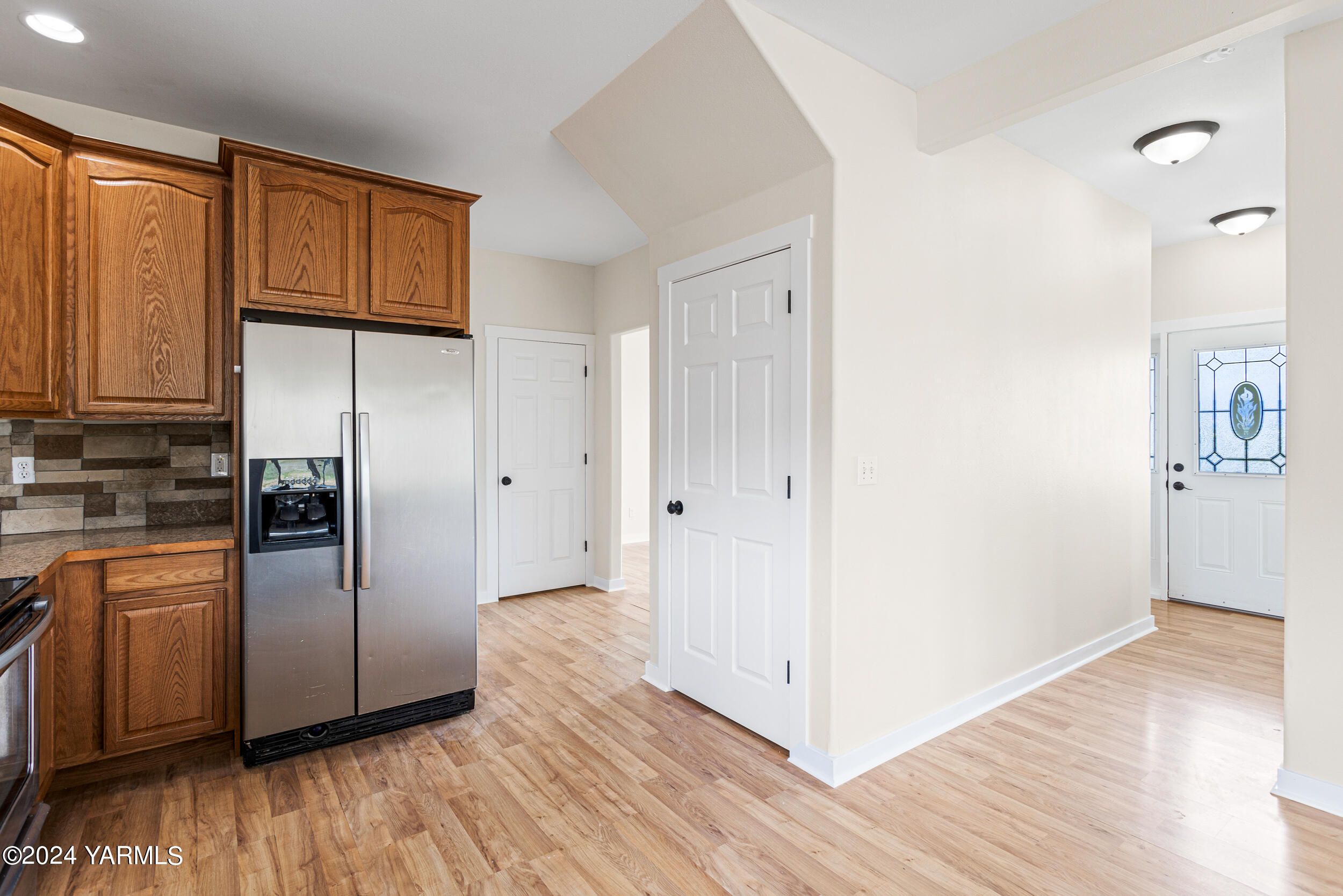 633 Hancock Road Cowiche, WA 98923 - Photo 23 of 53 a view of a refrigerator in kitchen and wooden floor