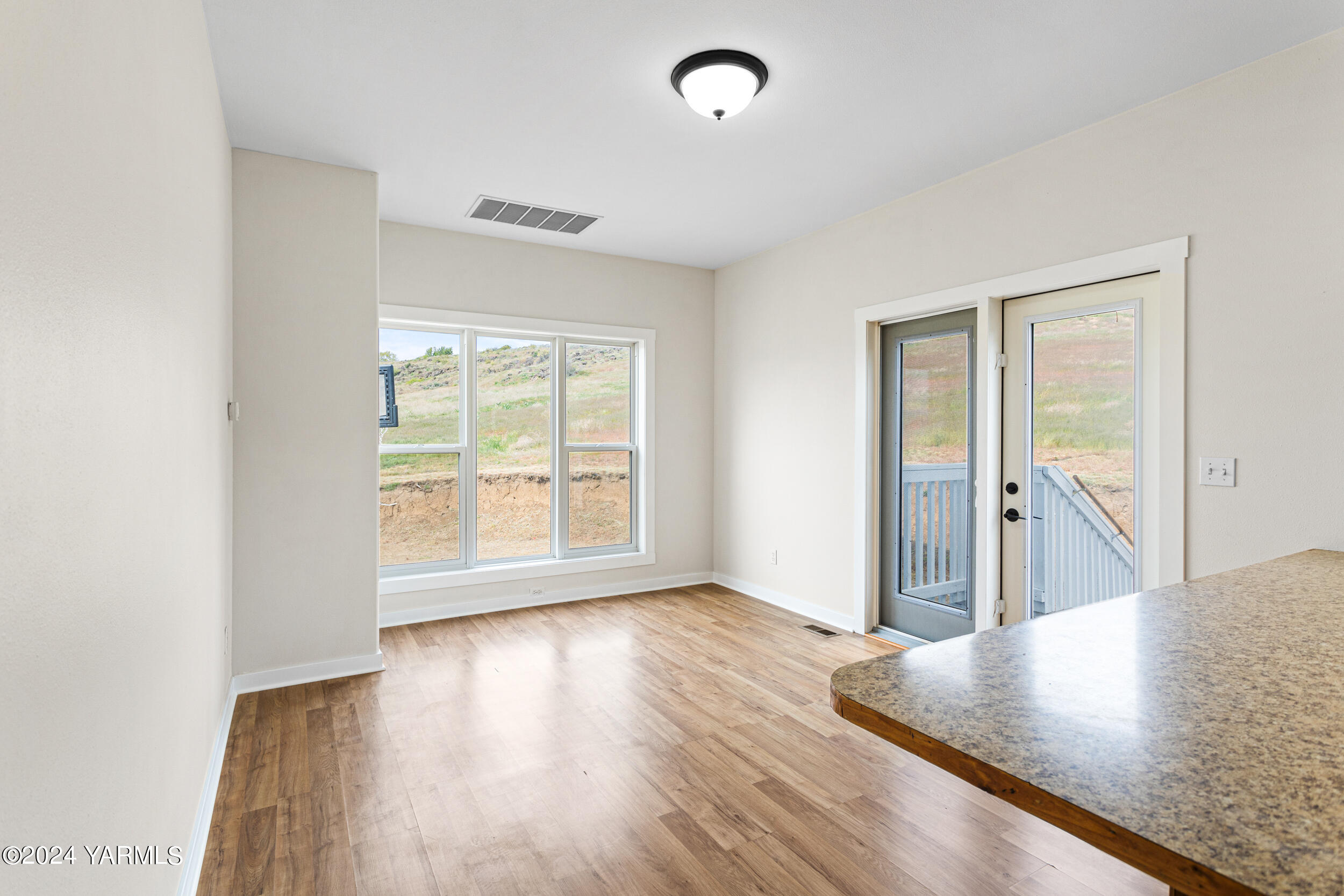 633 Hancock Road Cowiche, WA 98923 - Photo 28 of 53 wooden floor in an empty room with a window