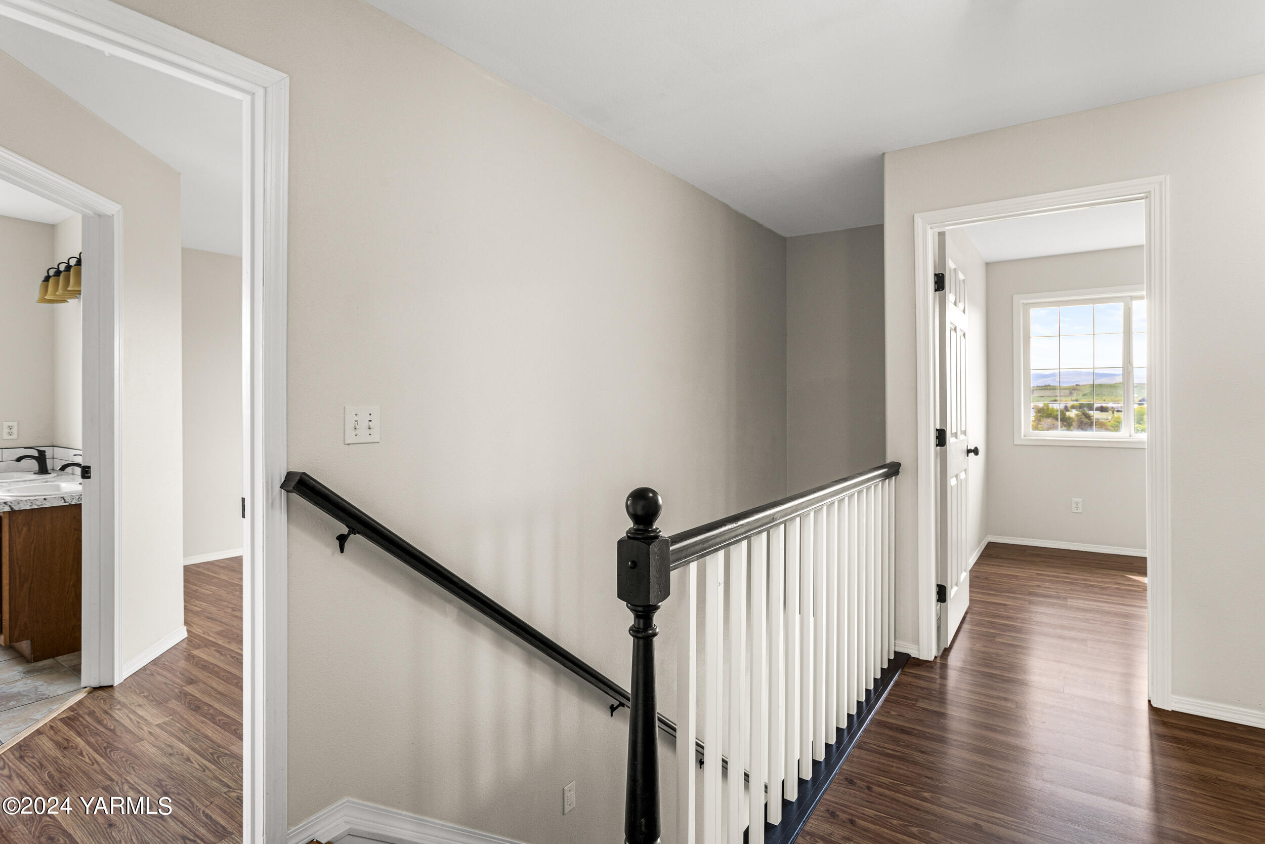 633 Hancock Road Cowiche, WA 98923 - Photo 33 of 53 a view of a hallway with wooden floor and staircase