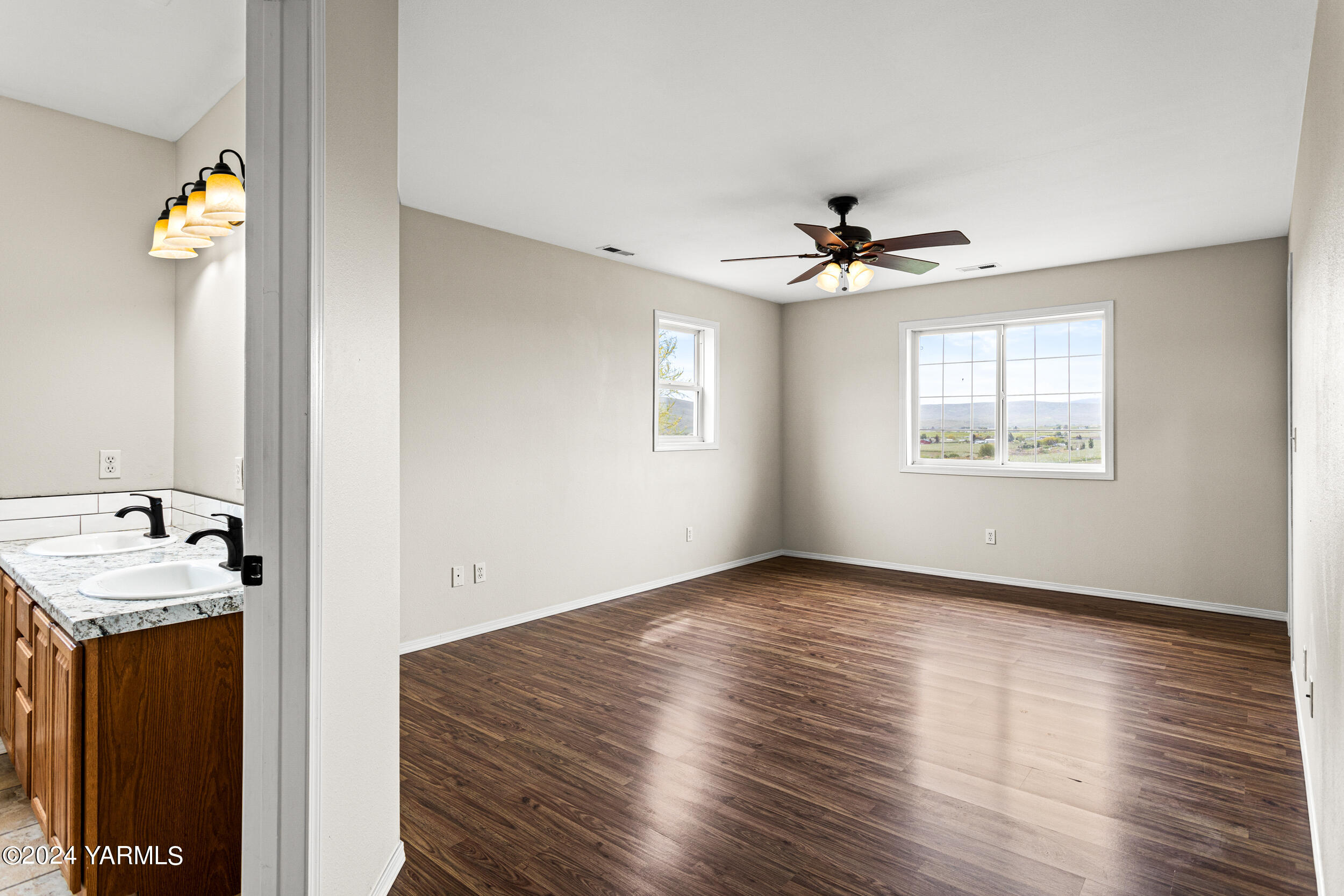 633 Hancock Road Cowiche, WA 98923 - Photo 34 of 53 wooden floor in an empty room with a window