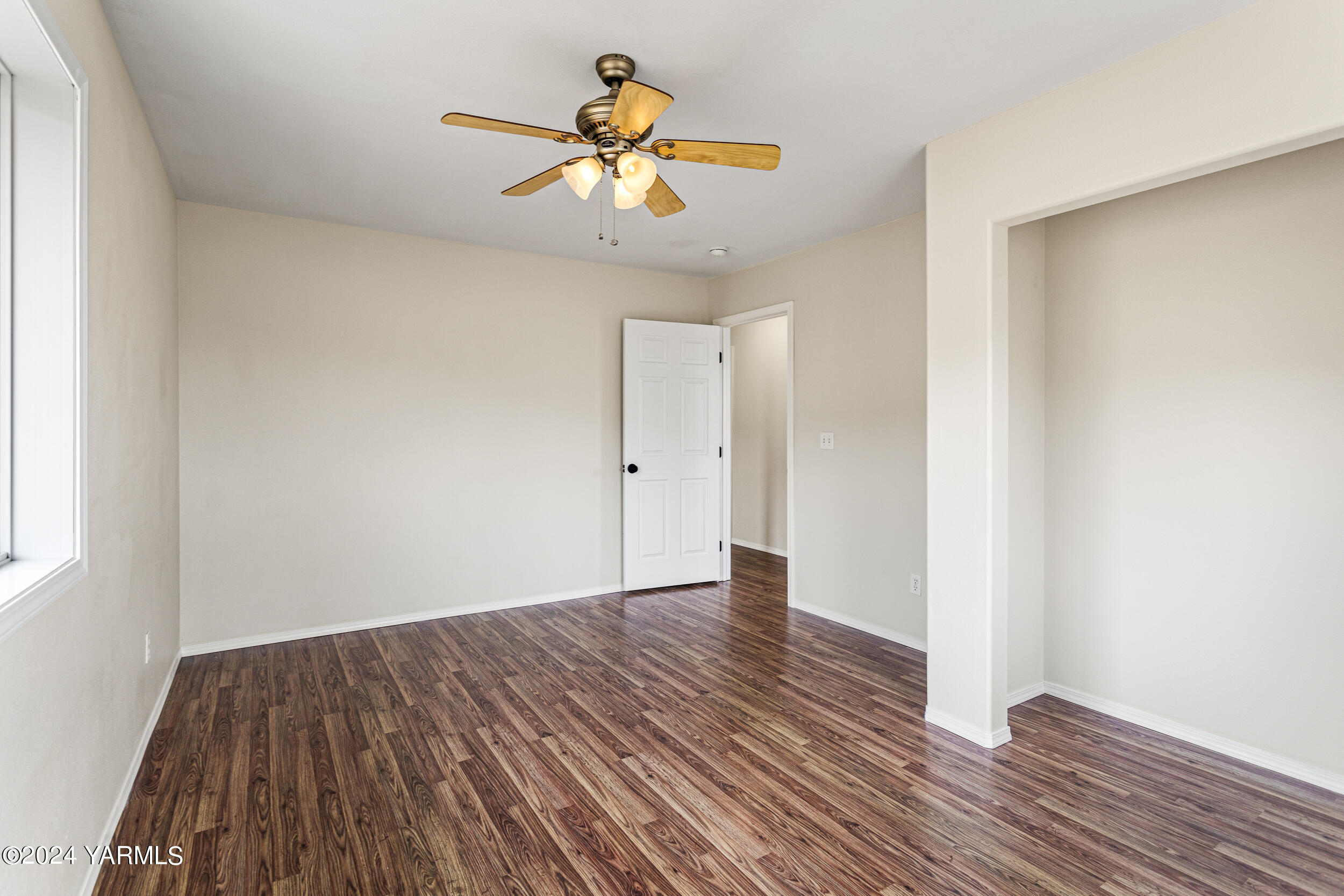 633 Hancock Road Cowiche, WA 98923 - Photo 43 of 53 a view of an empty room with wooden floor
