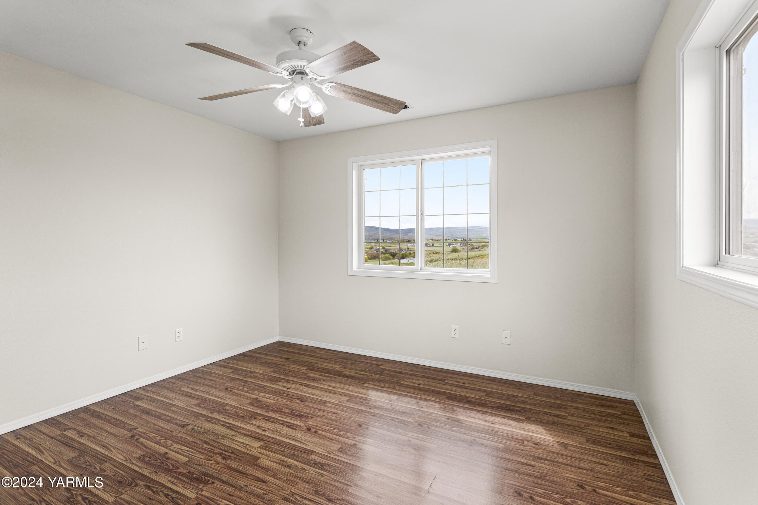 633 Hancock Road Cowiche, WA 98923 - Photo 44 of 53 wooden floor in an empty room with a window