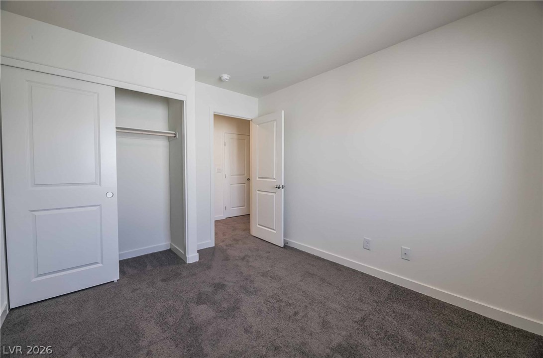 12749 Epperly Street Henderson, NV 89044 - Photo 17 of 22 A well-lit bedroom provides a blank canvas, offering versatility for personal style.