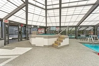 a view of a swimming pool with a patio