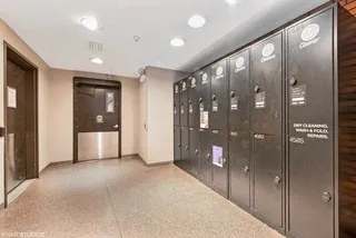 a view of hallway with a bathroom