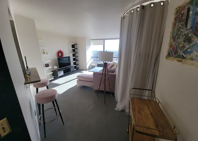 a living room with furniture and a window