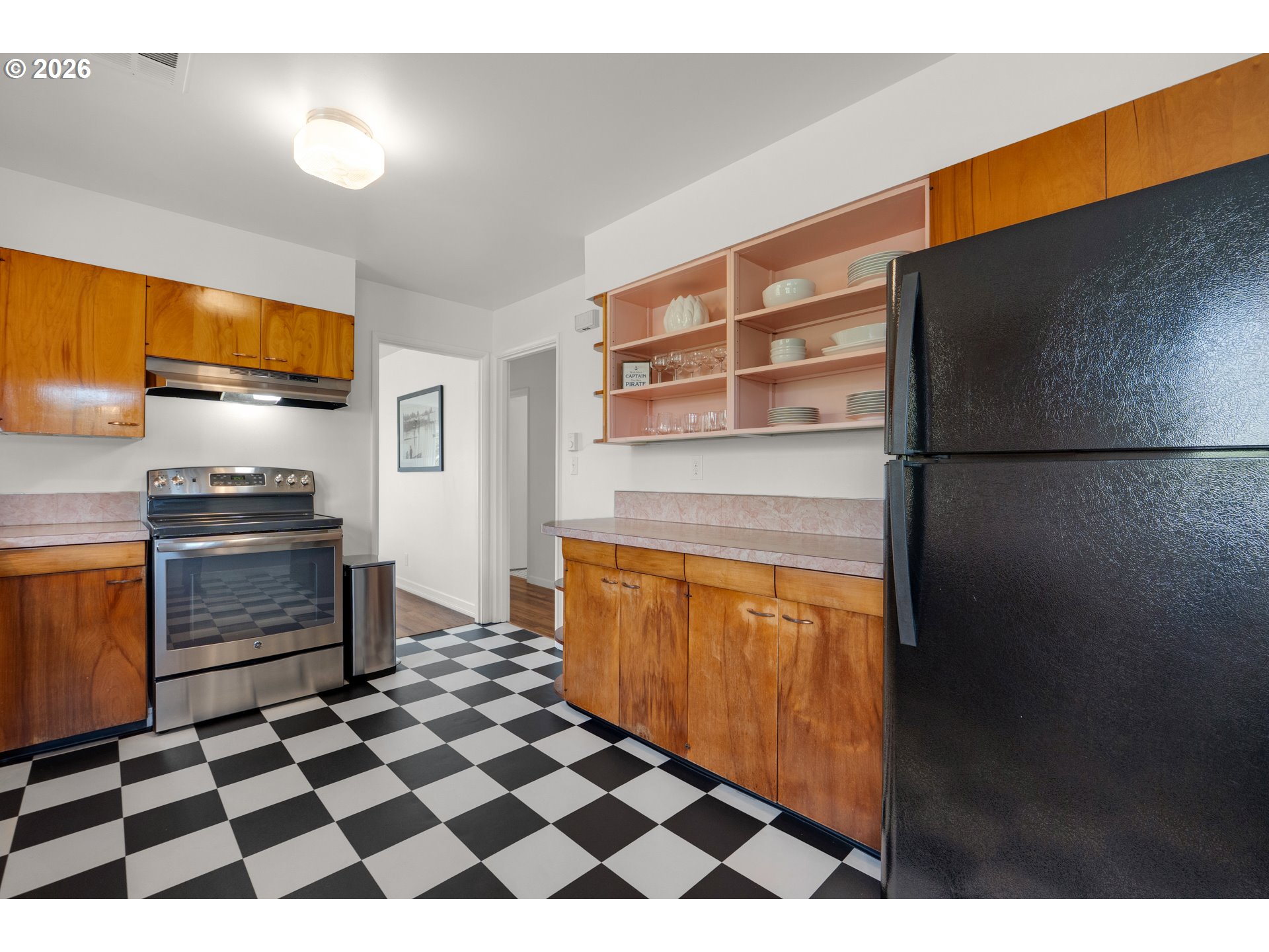 1210 South Columbia Street Seaside, OR 97138 - Photo 14 of 40 a kitchen with stainless steel appliances granite countertop a refrigerator and a stove top oven