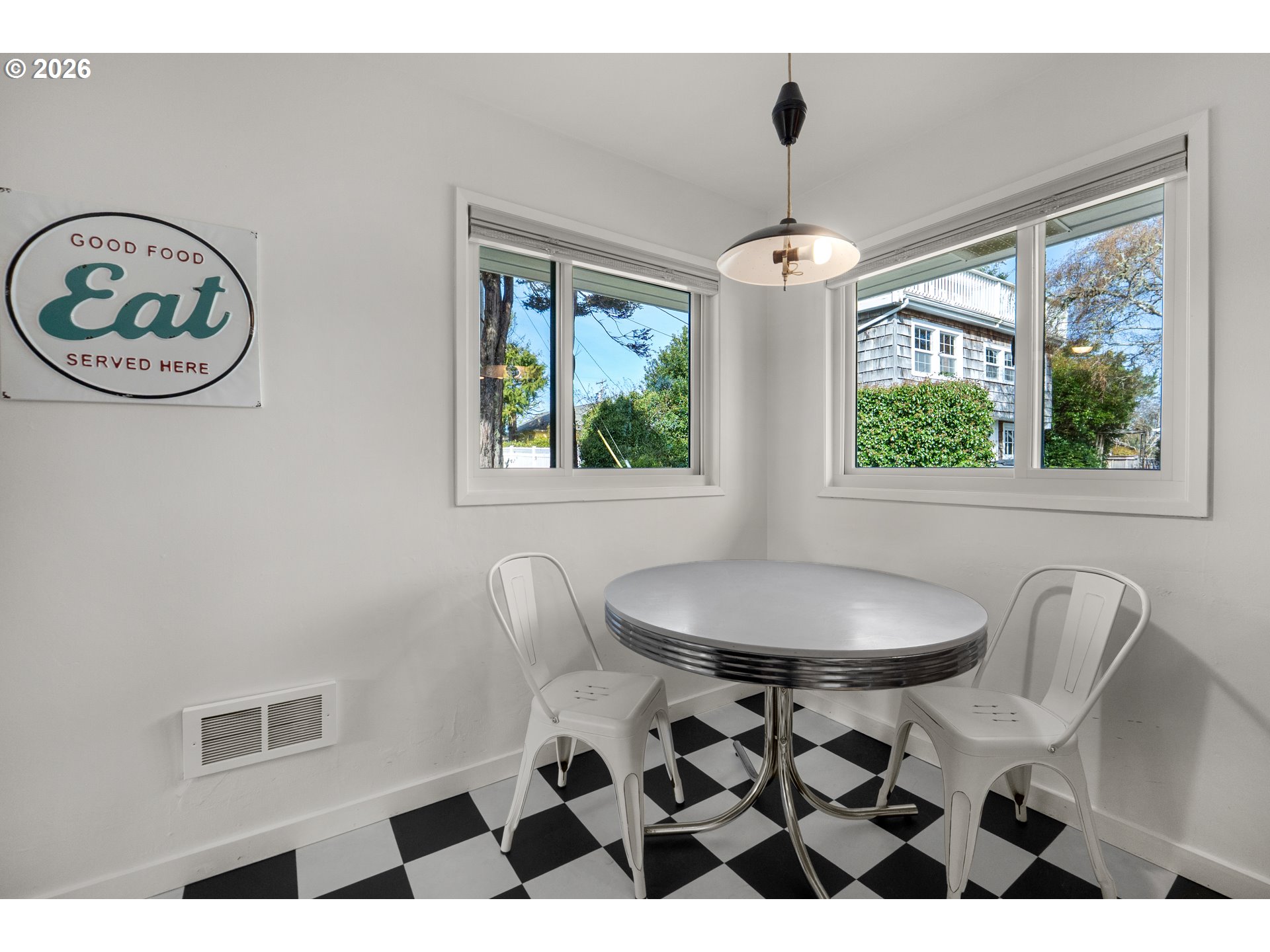 1210 South Columbia Street Seaside, OR 97138 - Photo 15 of 40 a view of a dining room with furniture window and outside view