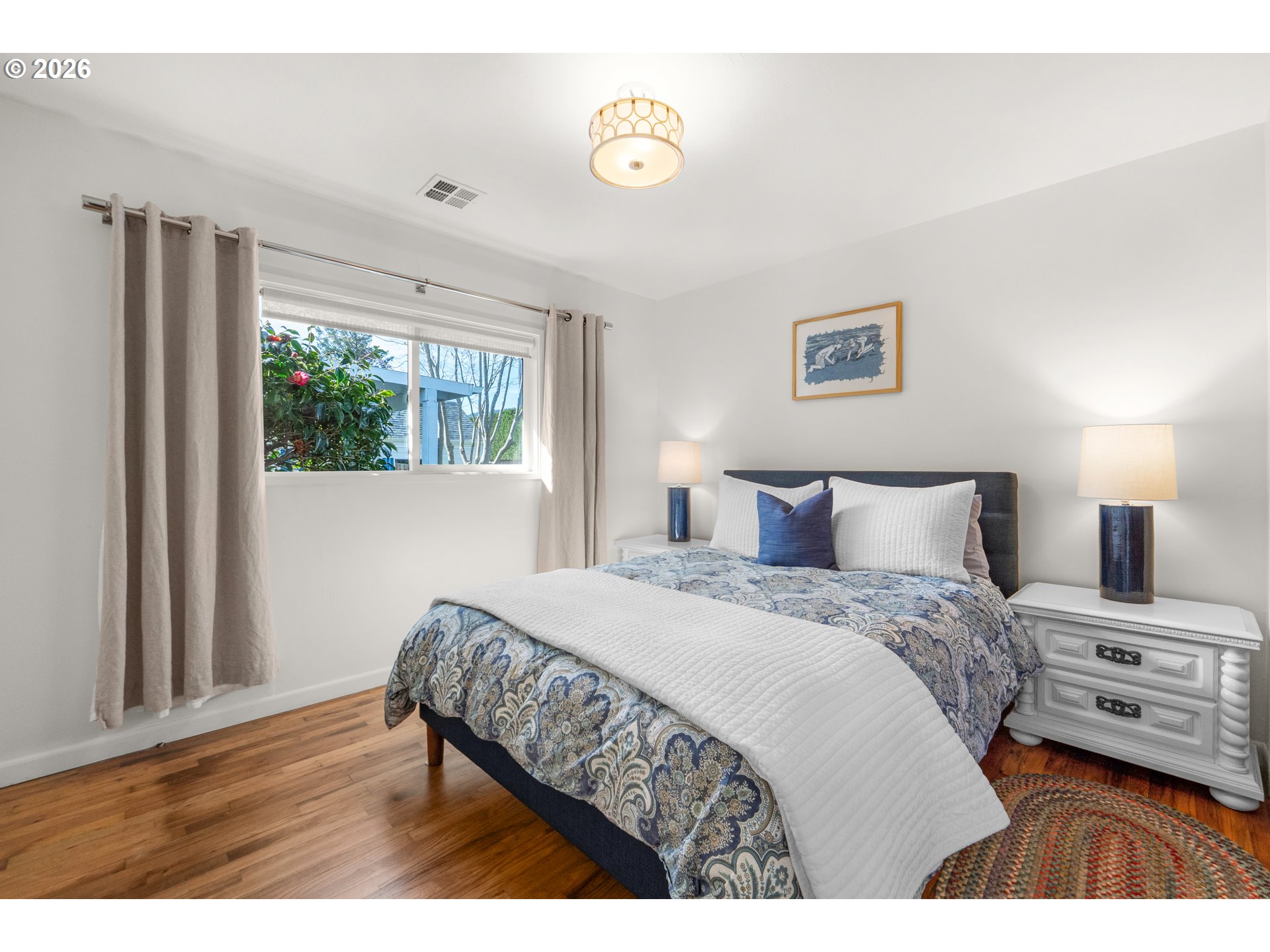 1210 South Columbia Street Seaside, OR 97138 - Photo 17 of 40 a bedroom with a bed and a tv