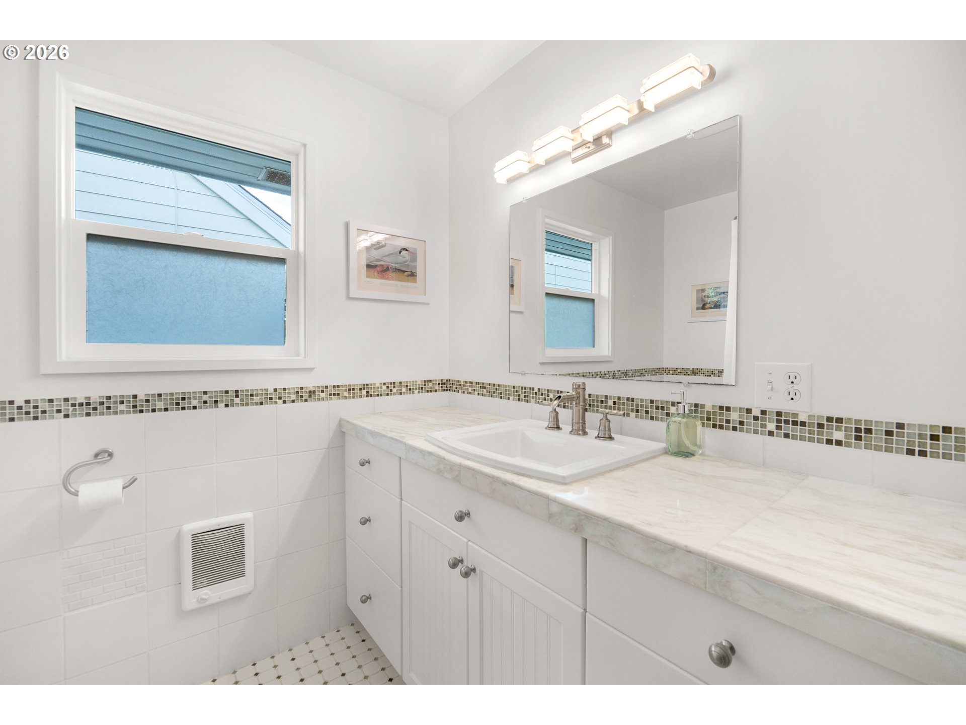 1210 South Columbia Street Seaside, OR 97138 - Photo 19 of 40 a bathroom with a sink and a mirror