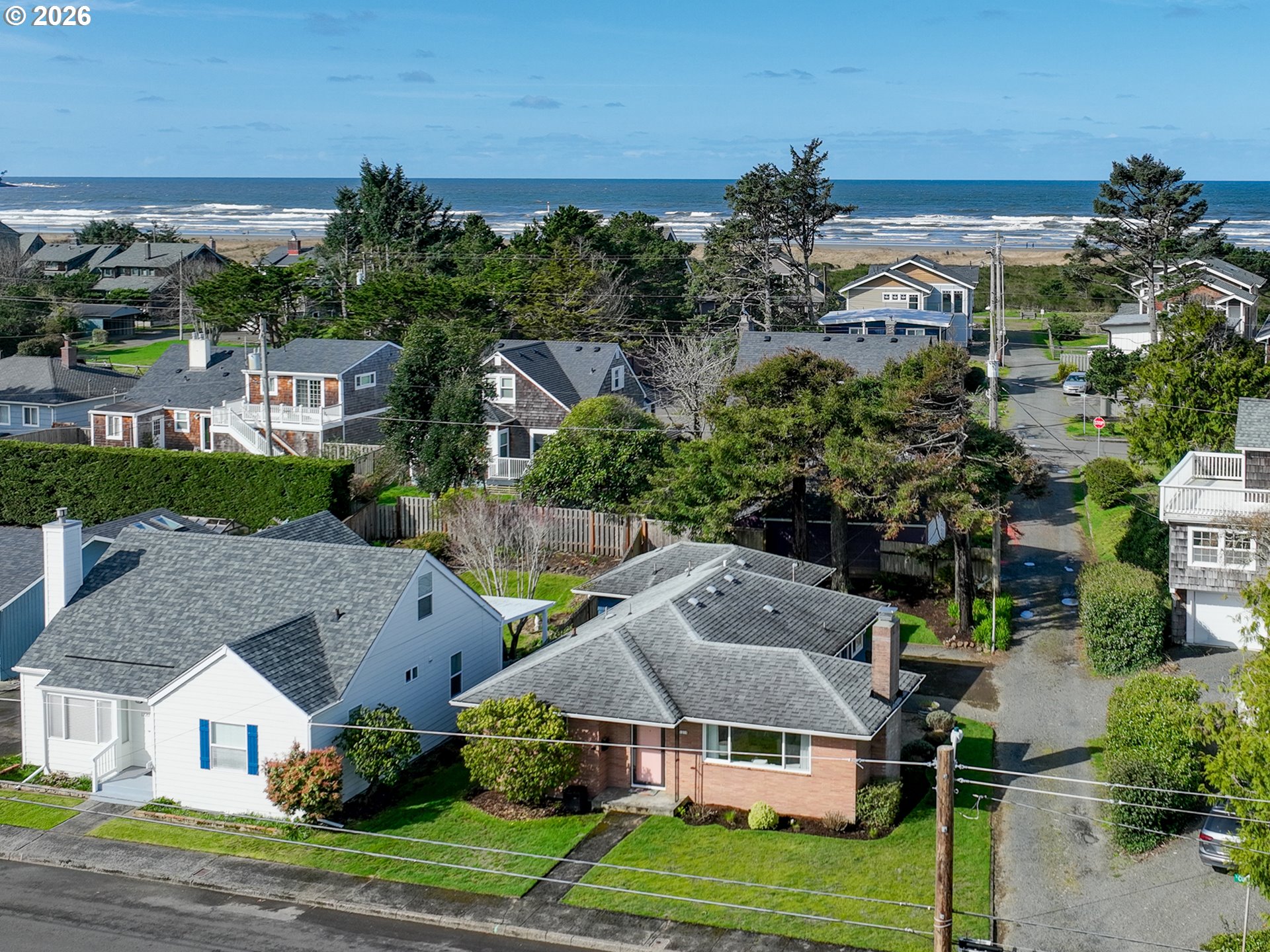 1210 South Columbia Street Seaside, OR 97138 - Photo 2 of 40 a aerial view of multiple houses with a yard