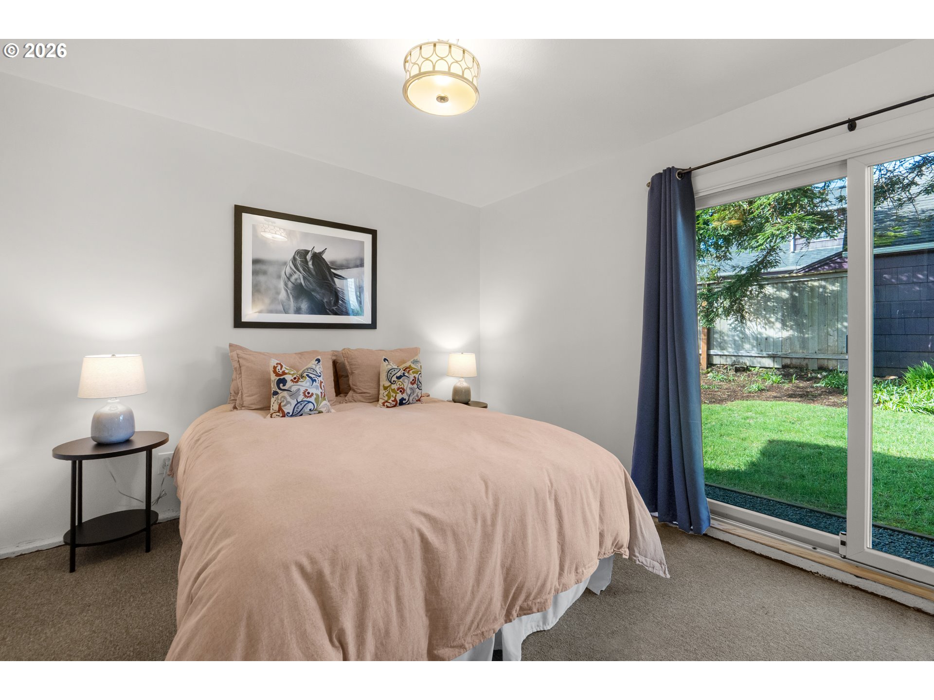 1210 South Columbia Street Seaside, OR 97138 - Photo 23 of 40 a bedroom with a bed and a large window