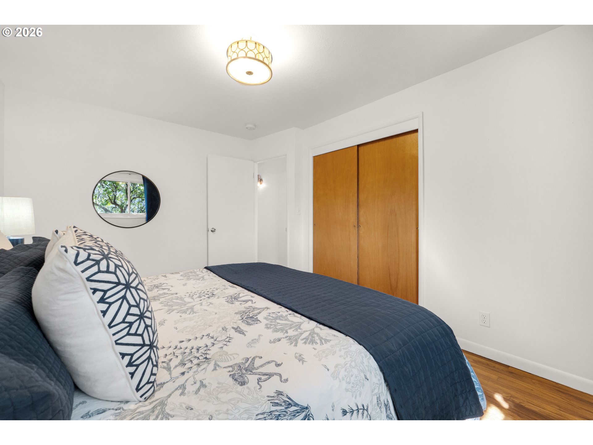 1210 South Columbia Street Seaside, OR 97138 - Photo 28 of 40 a bedroom with a bed and a window