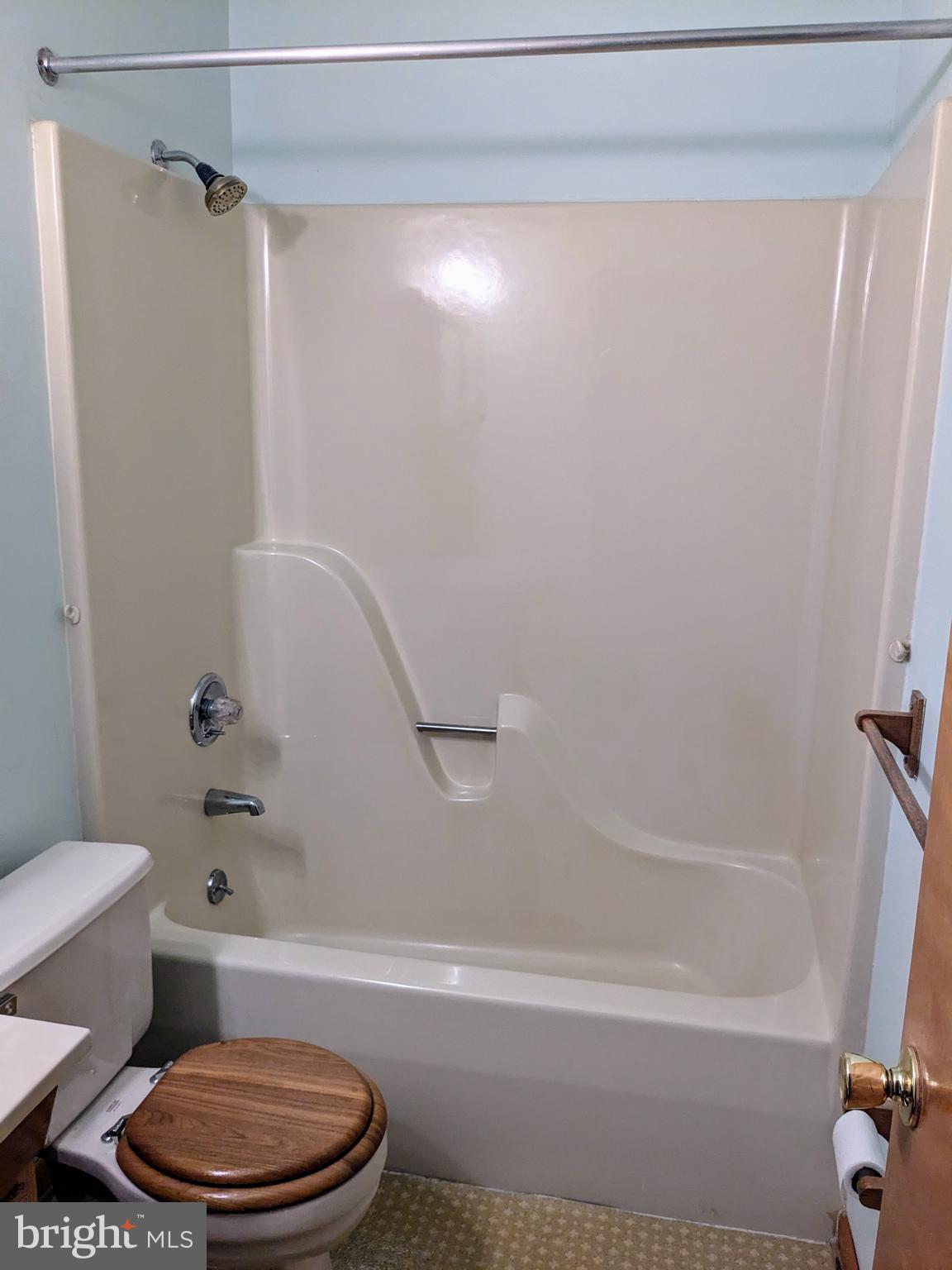 2408 Old Mountain Road Joppa, MD 21085 - Photo 12 of 25 a white bath tub sitting next to a toilet