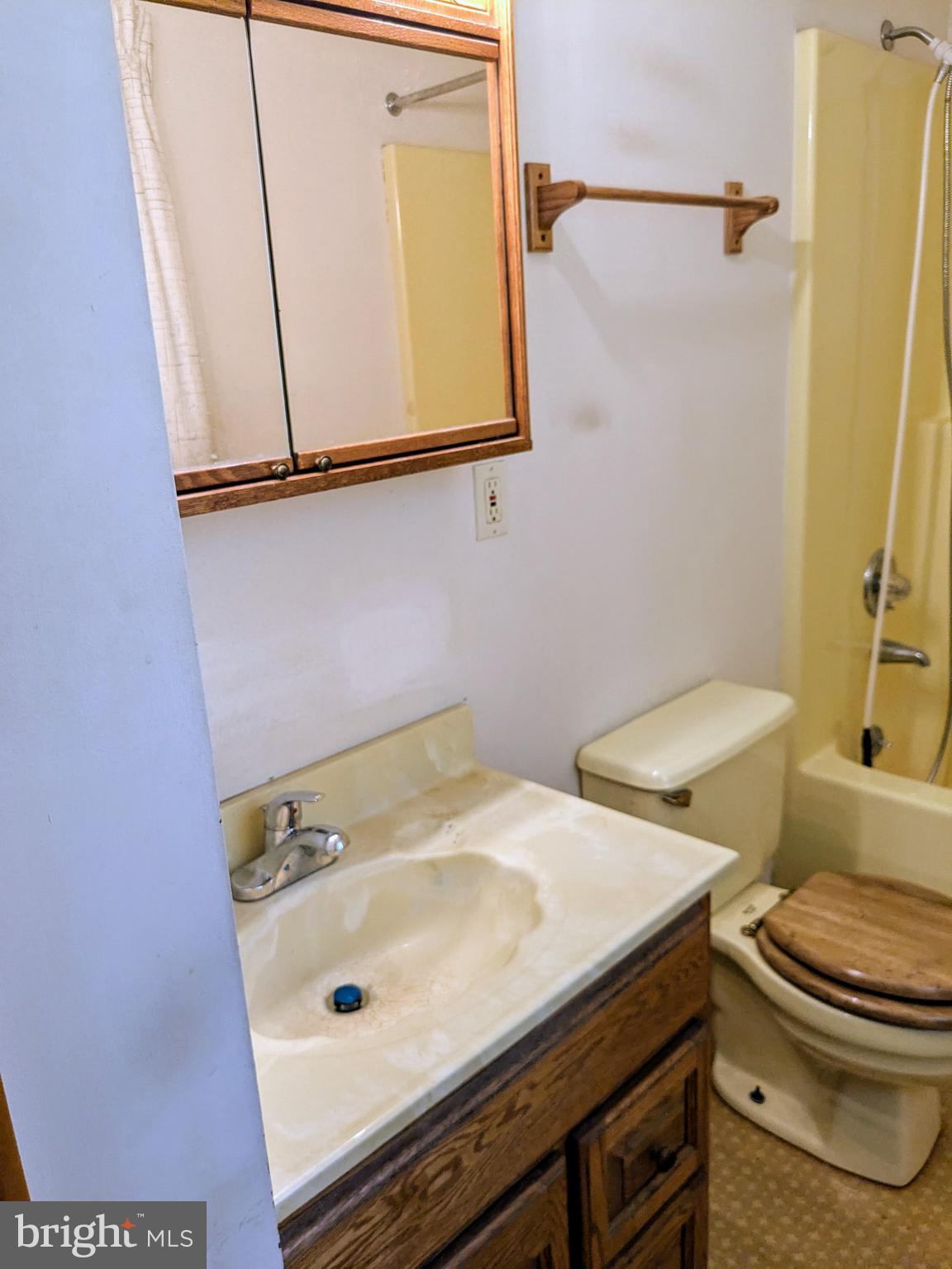 2408 Old Mountain Road Joppa, MD 21085 - Photo 14 of 25 a bathroom with a sink a toilet and a mirror
