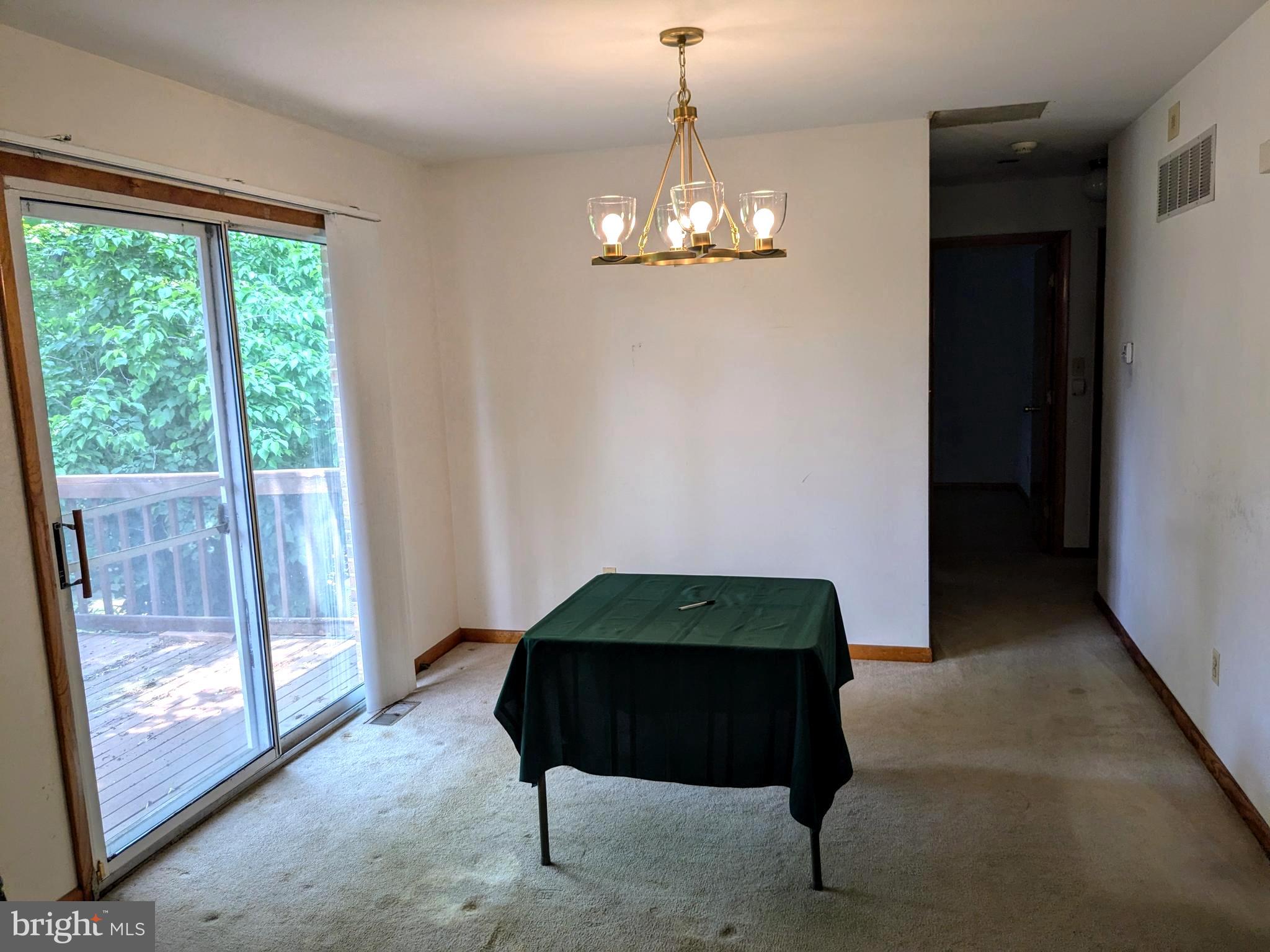 2408 Old Mountain Road Joppa, MD 21085 - Photo 8 of 25 a room with painting and a chandelier