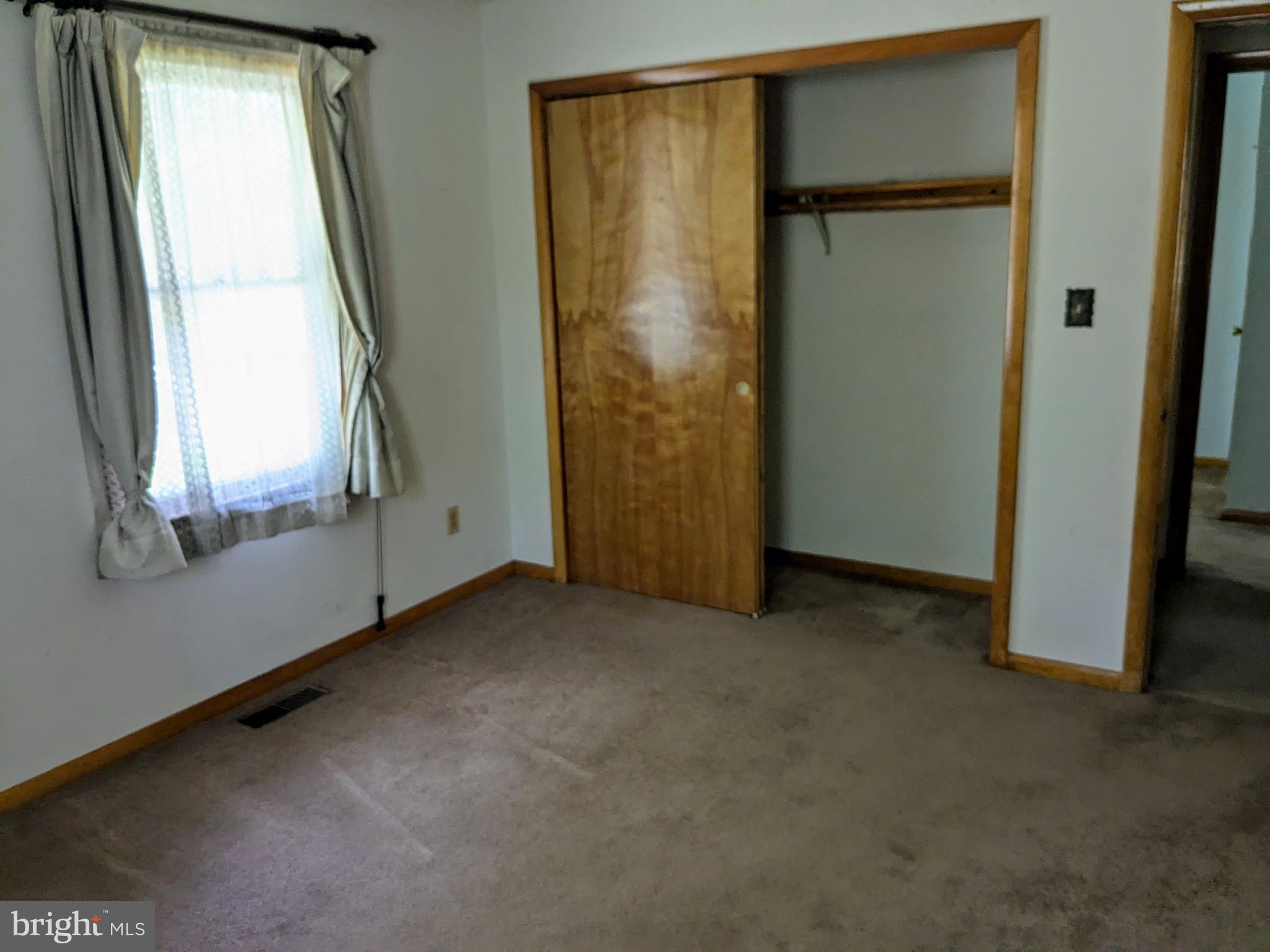 2408 Old Mountain Road Joppa, MD 21085 - Photo 9 of 25 an empty room with windows