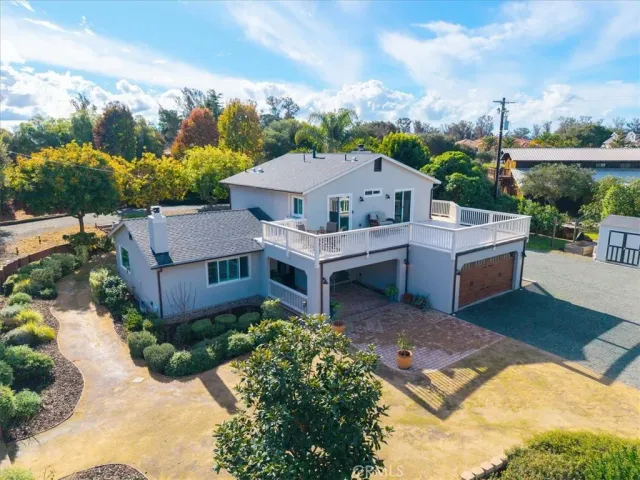 an aerial view of residential houses with outdoor space and swimming pool