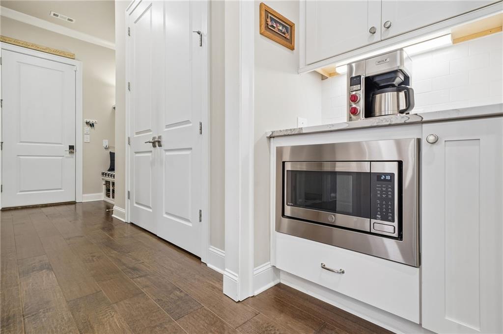 112 Idylwilde Way Canton, GA 30115 - Photo 18 of 46 a view of a livingroom with wooden floor and staircase