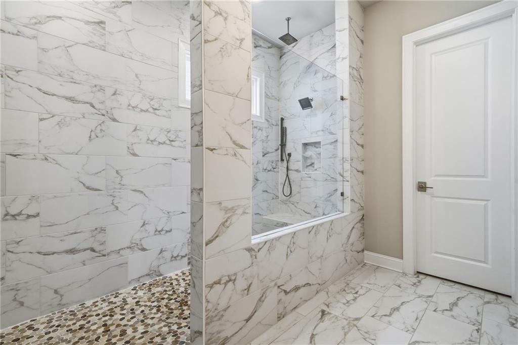 112 Idylwilde Way Canton, GA 30115 - Photo 22 of 46 a bathroom with a bathtub and shower