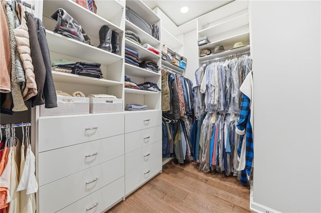 112 Idylwilde Way Canton, GA 30115 - Photo 24 of 46 a view of walk in closet with clothes and shoes
