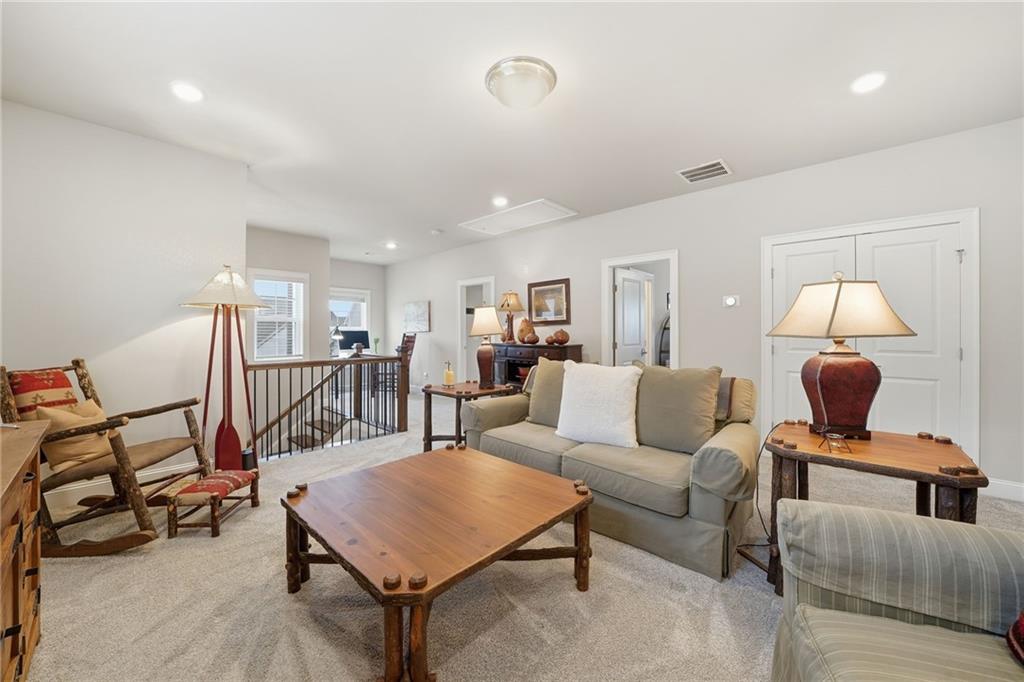 112 Idylwilde Way Canton, GA 30115 - Photo 28 of 46 a living room with furniture and a wooden floor