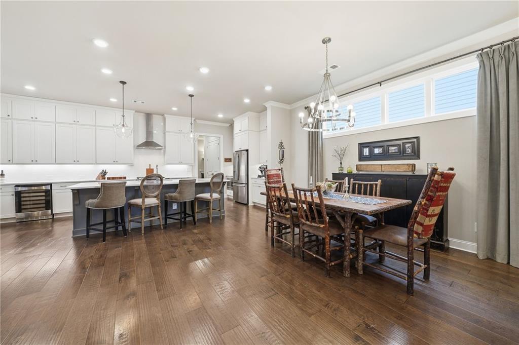 112 Idylwilde Way Canton, GA 30115 - Photo 10 of 46 a view of a dining area with furniture window and wooden floor