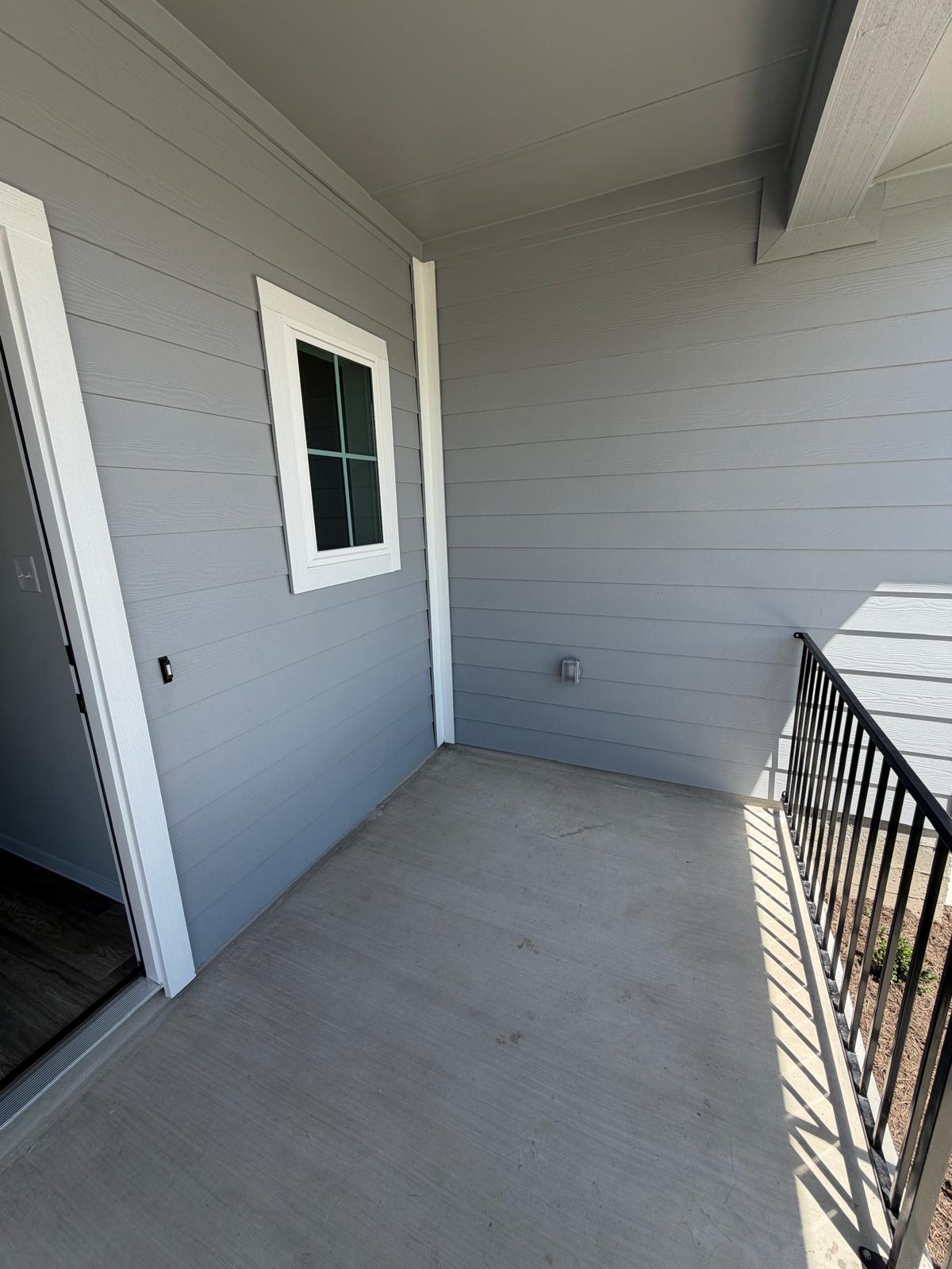 2612 Towy Road Manor, TX 78653 - Photo 6 of 35 A compact private patio offers an ideal space for outdoor relaxation and quiet contemplation.