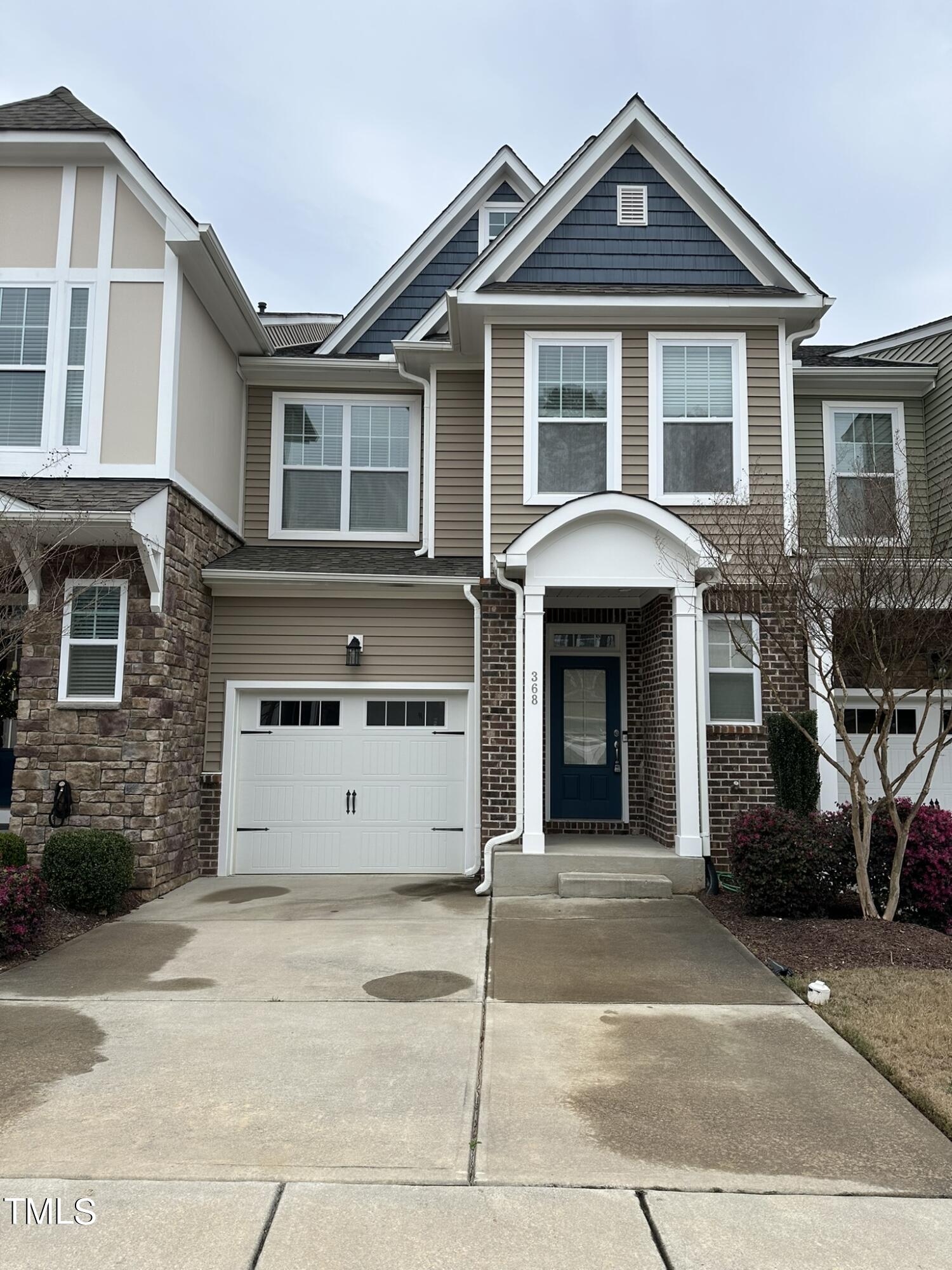 368 Roberts Ridge Drive Cary, NC 27513 - Photo 1 of 5 a view of a white house with large windows