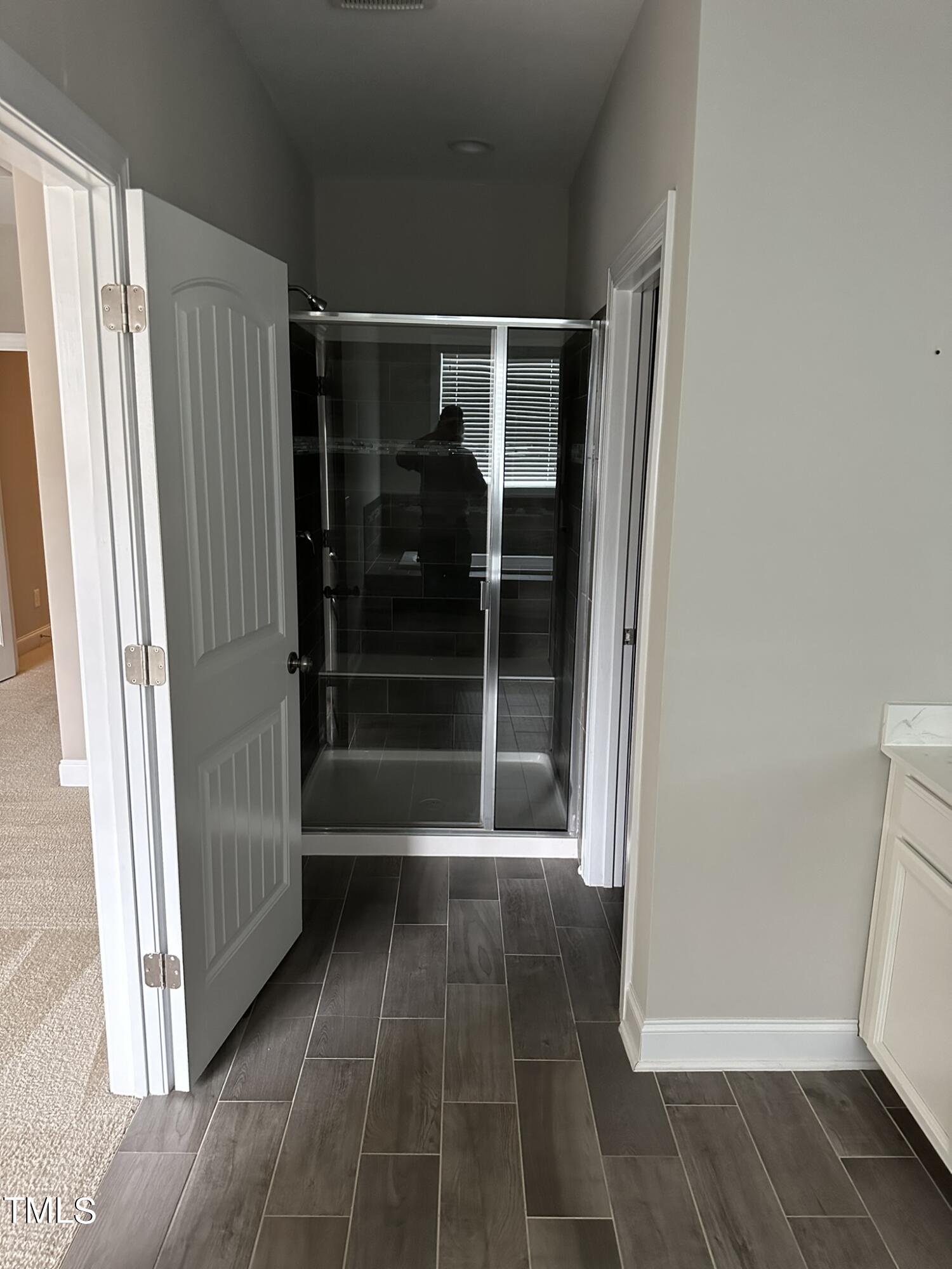 368 Roberts Ridge Drive Cary, NC 27513 - Photo 3 of 5 a bathroom with a glass shower door