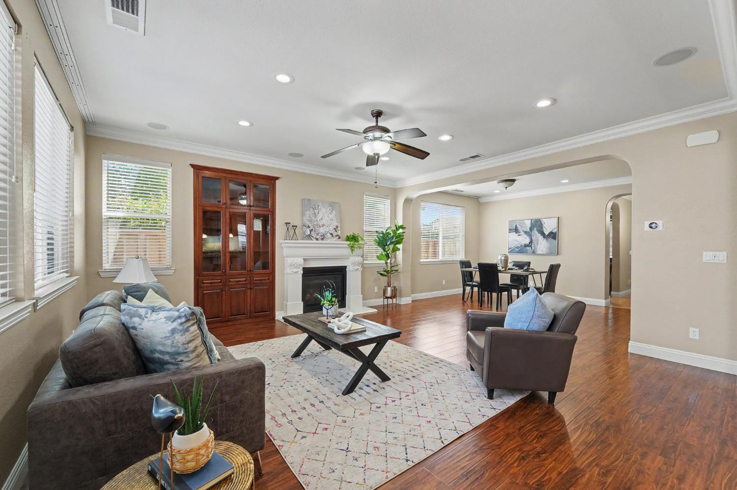 1223 East Springer Drive Turlock, CA 95382 - Photo 12 of 48 a living room with furniture a fireplace and a table