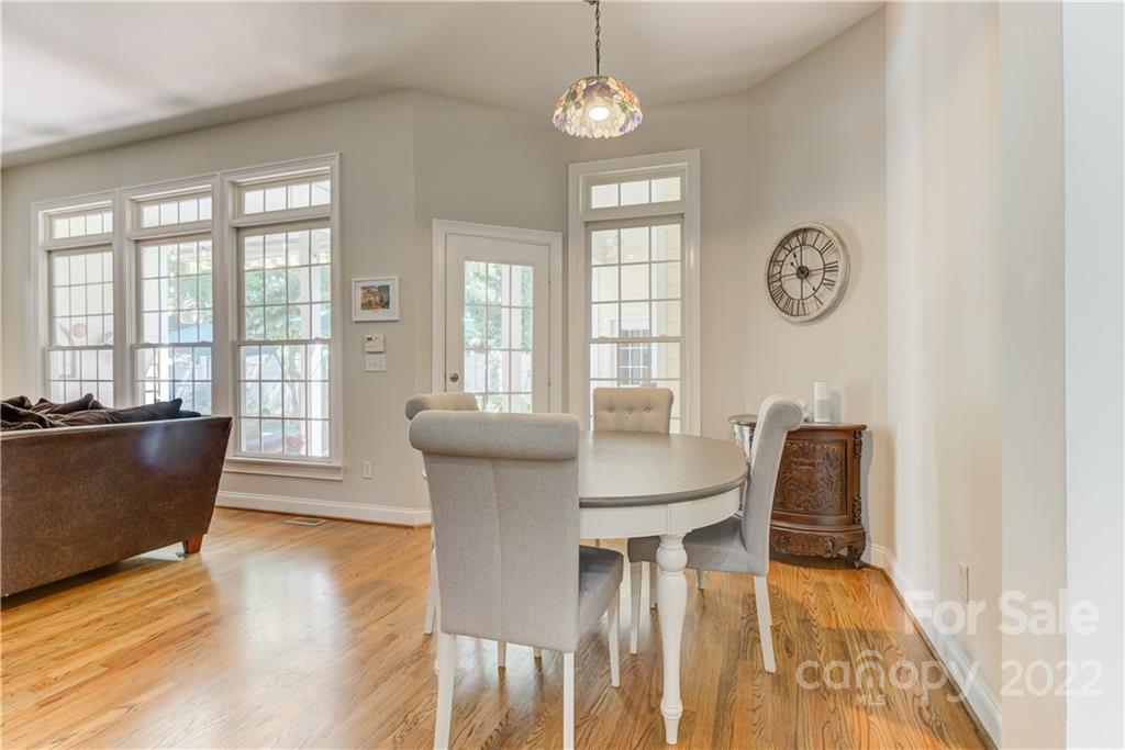 783 Julia Street Fort Mill, SC 29708 - Photo 17 of 48 a view of a dining room with furniture window and wooden floor