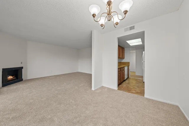 a view of a kitchen with a sink and dishwasher