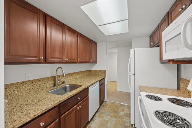 a kitchen with a stove and a refrigerator