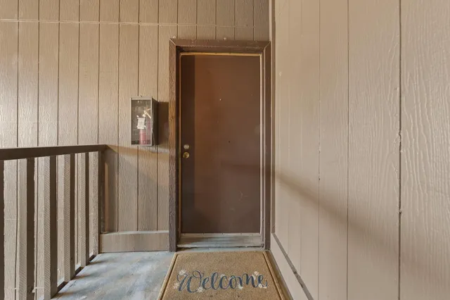 an empty room with floor to ceiling window