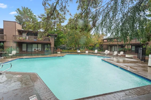 a view of a patio with swimming pool