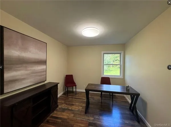 a workspace with furniture window and wooden floor