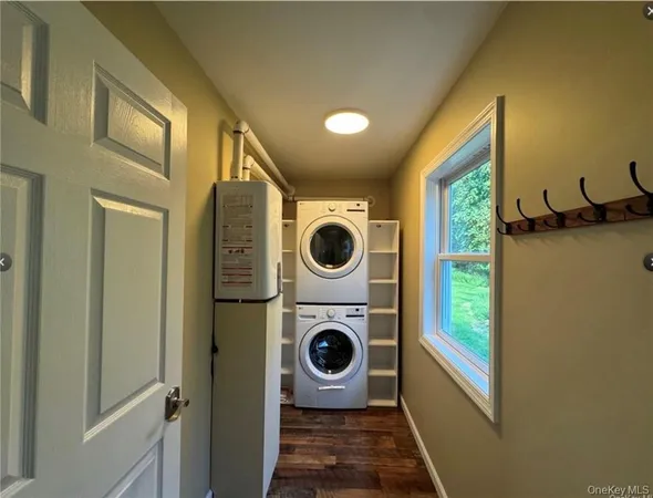 a view of a hallway with washer and dryer