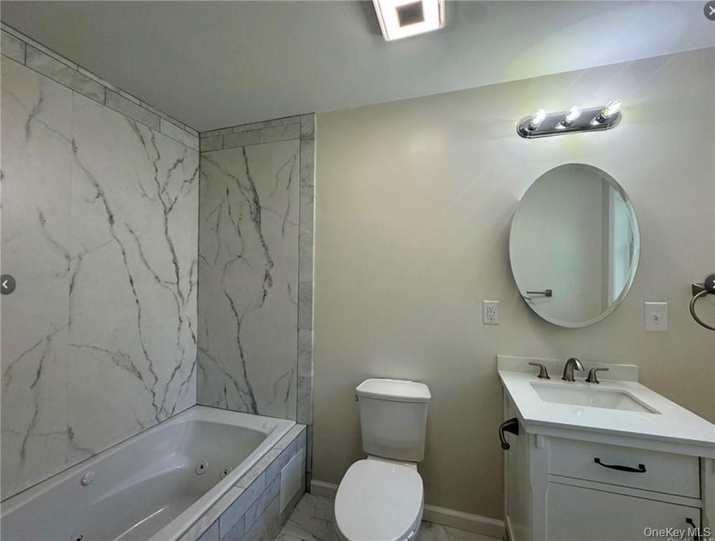 30 Daly Road Middletown, NY 10940 - Photo 20 of 24 a bathroom with a toilet sink and mirror