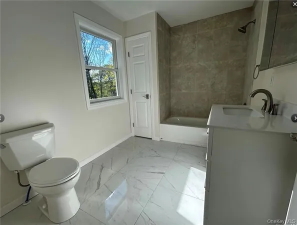 a bathroom with a toilet and a sink