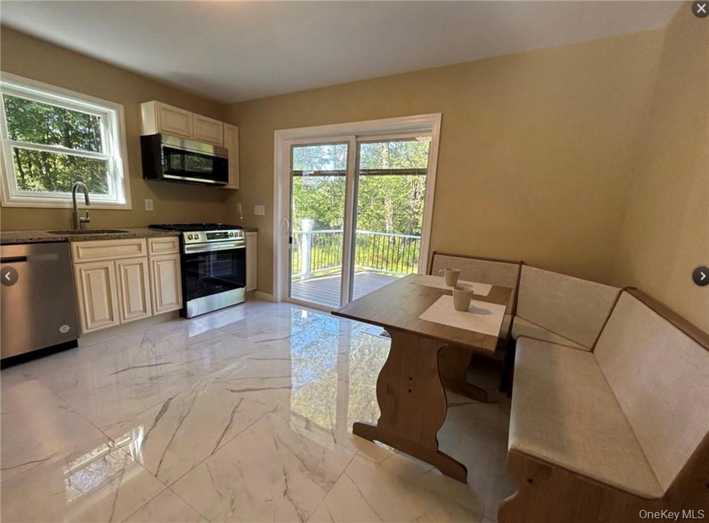 30 Daly Road Middletown, NY 10940 - Photo 4 of 24 a kitchen with a sink and a stove top oven