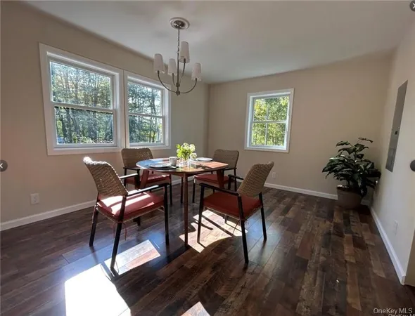 a view of a dining room with furniture window and outside view