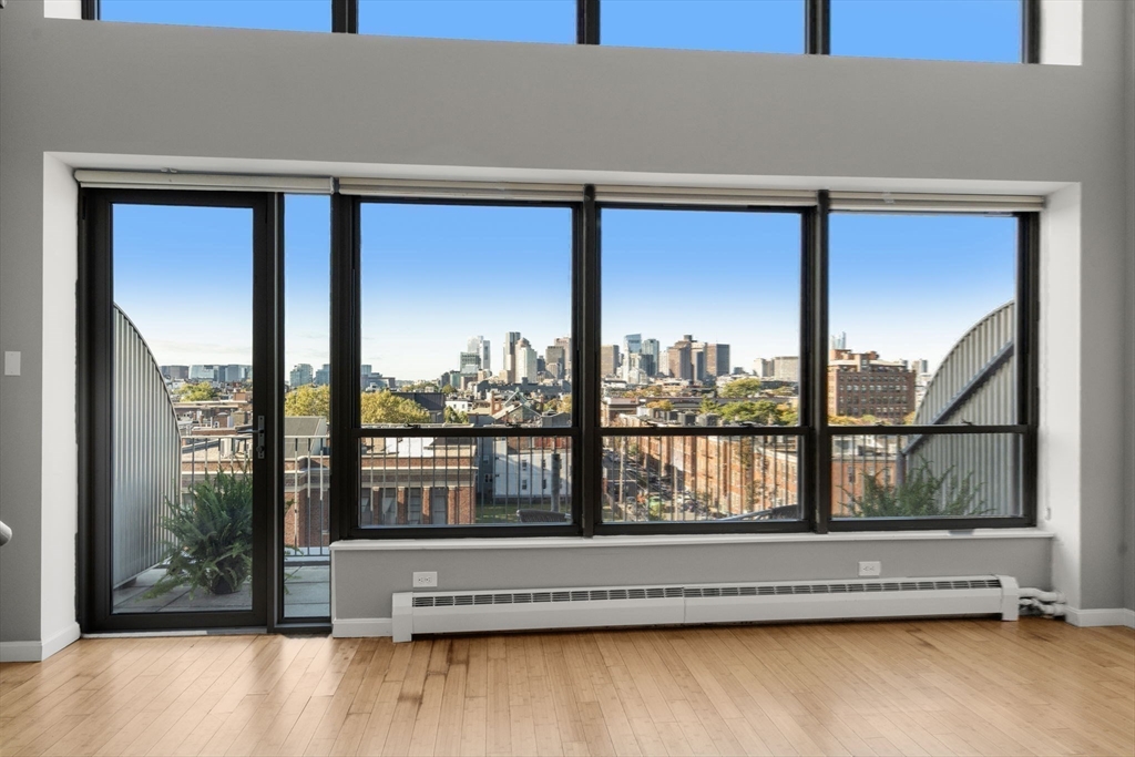 156 Porter Street, Unit 421 Boston, MA 02128 - Photo 16 of 29 a view of a large window with a living room