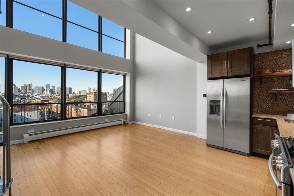 156 Porter Street, Unit 421 Boston, MA 02128 - Photo 4 of 29 a view of an empty room with a window
