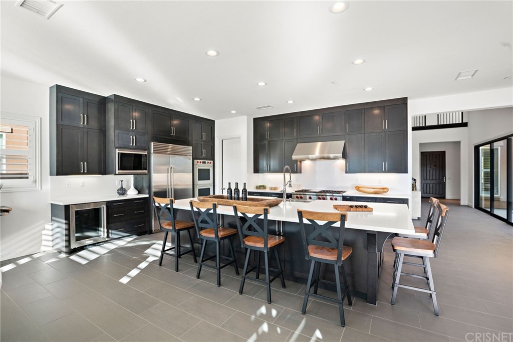 11907 Ancona Way Porter Ranch, CA 91326 - Photo 13 of 67 a view of a dining room with furniture