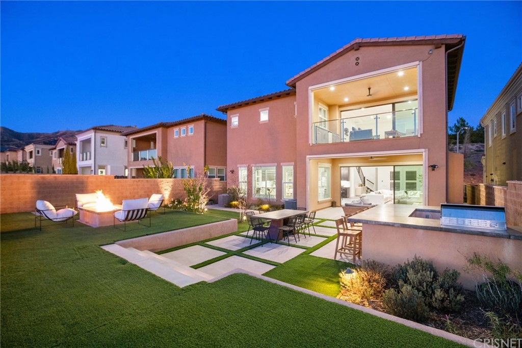 11907 Ancona Way Porter Ranch, CA 91326 - Photo 2 of 67 a view of a house with swimming pool and sitting area