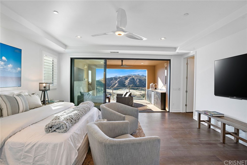 11907 Ancona Way Porter Ranch, CA 91326 - Photo 29 of 67 a bedroom with furniture and a large window